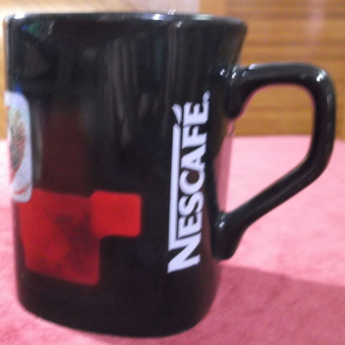 Nescafe ceramic mug black, like new, engraved logo