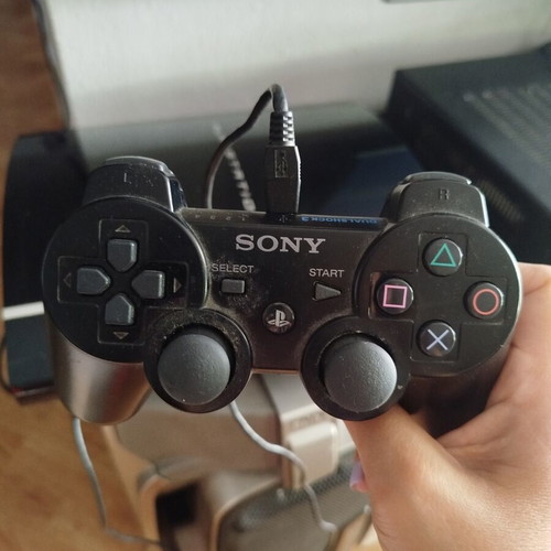 PlayStation 3 console used with controller, charging cable and 6 games