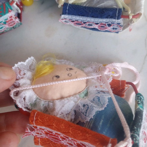 Seven cloth baby dolls in cradle new