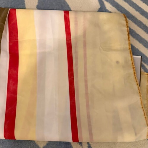 Fabric shower curtain with stripes used, metal grommets