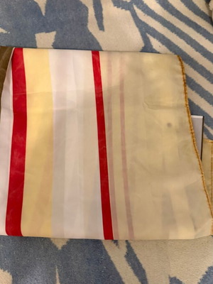 Fabric shower curtain with stripes used, metal grommets