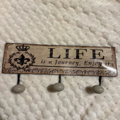 Wall hook like new with Life is a journey, enjoy it inscription