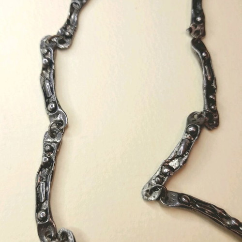 Statement necklace Dino Dinel new with articulated Pebbles motif