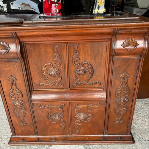 Singer sewing machine in carved furniture used, antique
