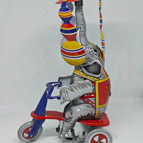Vintage metal elephant on tricycle like new