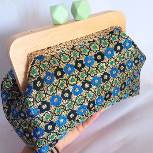 Handmade shoulder bag with traditional embroidery and wooden clasp