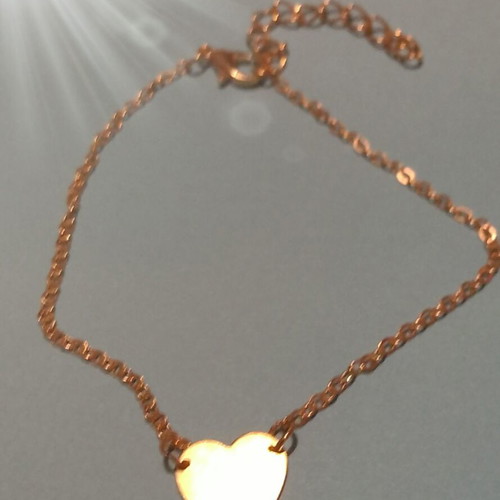 Gold-colored heart bracelet with chain