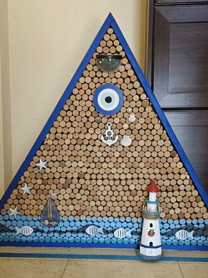 Sea-themed wall art with 600 corks and lighting