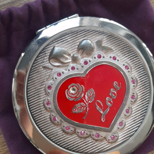 Compact mirror for bag used with purple velvet pouch