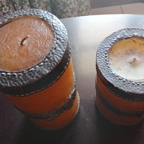 Set of two decorative candles with belt motif, brown and olive