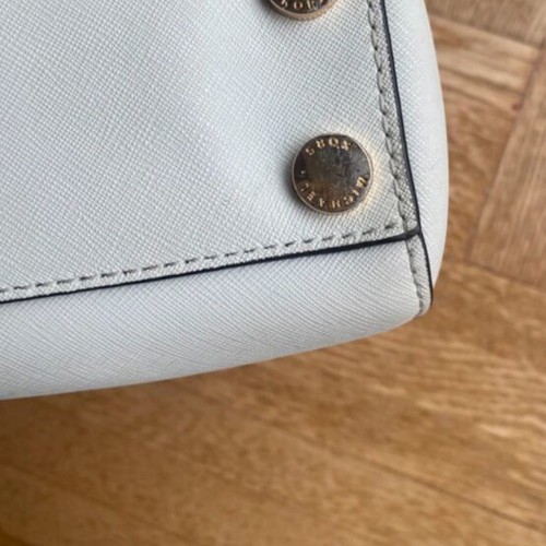 Michael Kors white tote bag with floral and dragonfly details