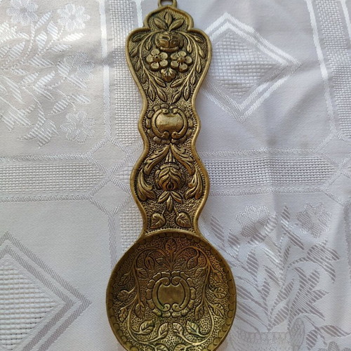 Brass decorative item like new with intricate carvings 24 cm long