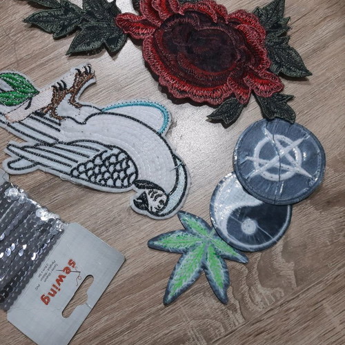 Iron-on patches for garments used with sequins and embroidery designs