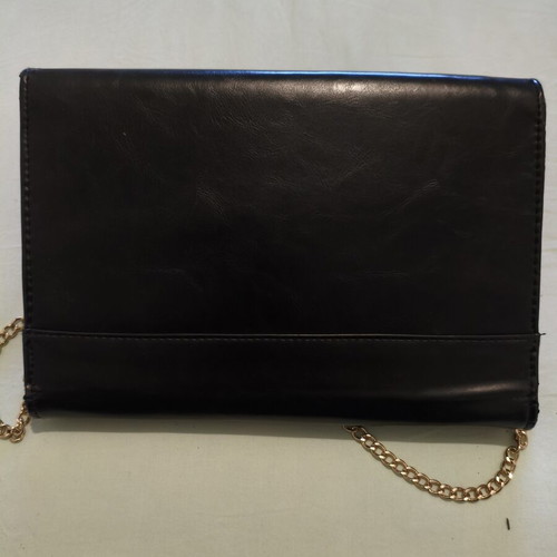 Black clutch bag with gold chain used, synthetic leather