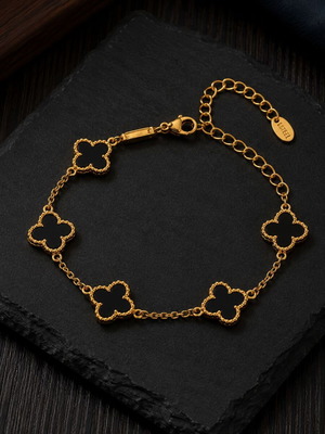 Exis Jewellery gold bracelet with black clover charms