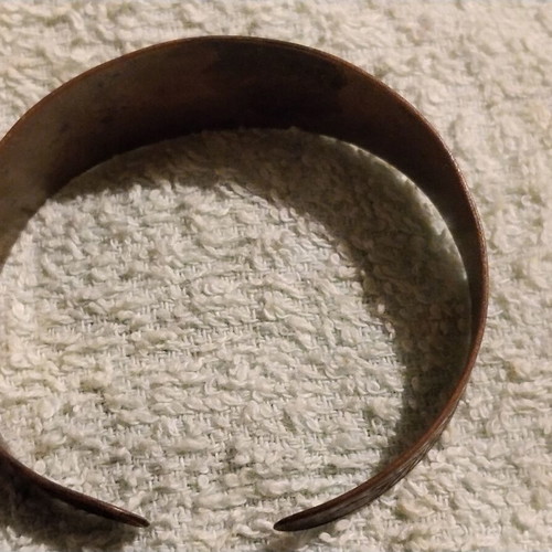 Vintage copper cuff bracelet with Greek neoclassical motifs, used