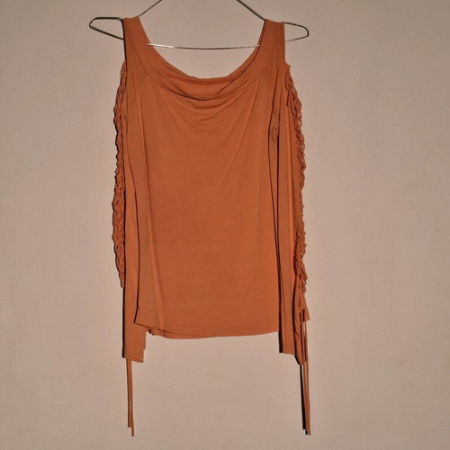 Orange shirt like new with knitted holes on sleeve
