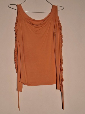 Orange shirt like new with knitted holes on sleeve