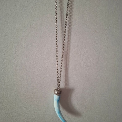 Long necklace used with elephant tooth design in white and turquoise