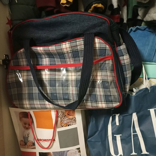 Baby outing bag used with many compartments and changing mat