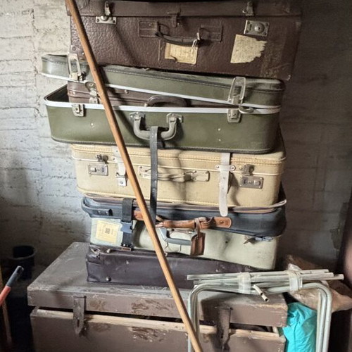 Vintage suitcases and large wooden trunk
