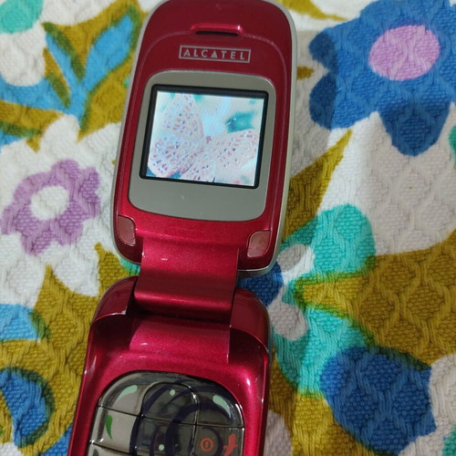 Alcatel vintage flip phone used, red, charger included