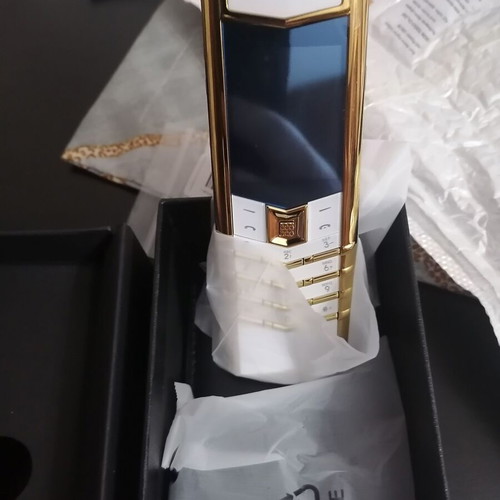 Vertu phone new, gold with metal leather body and dual card slot