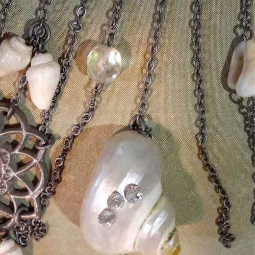 Accessorize necklace new with mother of pearl, shells, crystals, and metal details