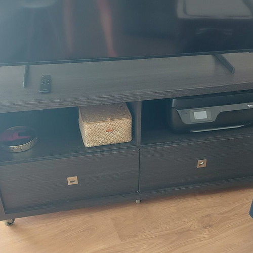 TV stand like new with two drawers and two shelves, wheels