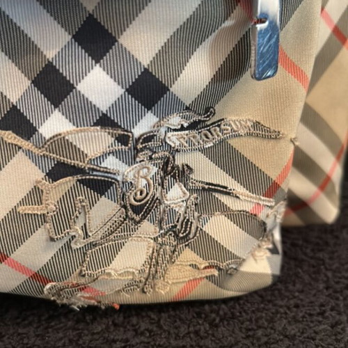 Burberry backpack like new with 2 zippered compartments and adjustable straps