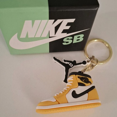 Nike keychain new, yellow and black in box