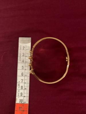 Bracelet in gold color with carved flowers like new