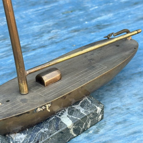 Vintage brass sailboat decoration on marble base, used