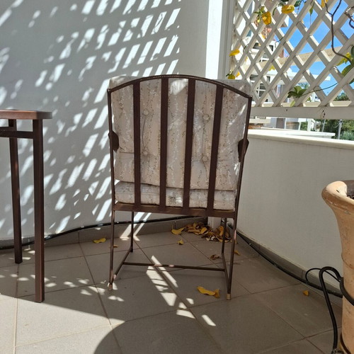 Retro wrought iron garden armchair with cushions used
