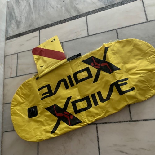 Apnea spearfishing equipment used with jacket, gloves, boots, and buoy