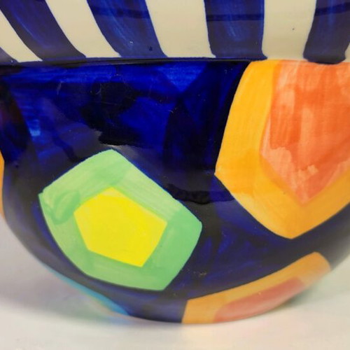 Mexican style ceramic plate and vase with plant composition used