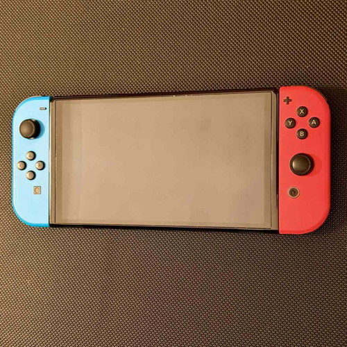 Nintendo Switch OLED used with carrying case and 256GB memory card