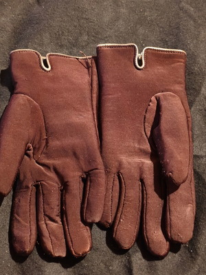 Women's brown gloves used with fleece lining and decorative tassels