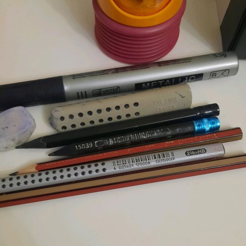Pencils pens erasers and sharpener set used