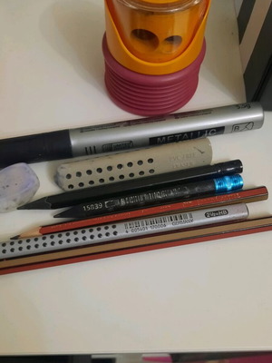 Pencils pens erasers and sharpener set used