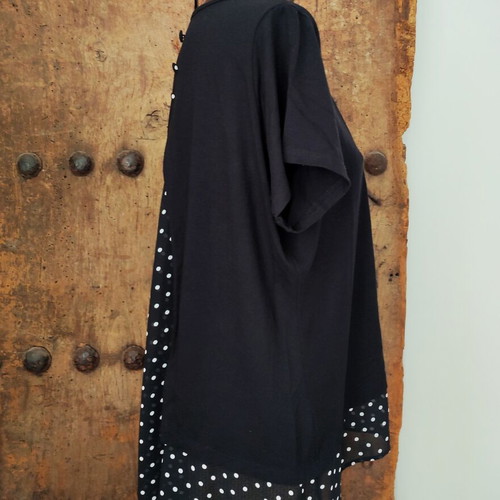 Women's black T-shirt with polka dot chiffon open back and button detail