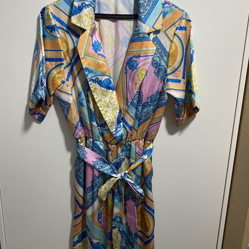 Printed jumpsuit like new with belt at waist, short sleeves, size M