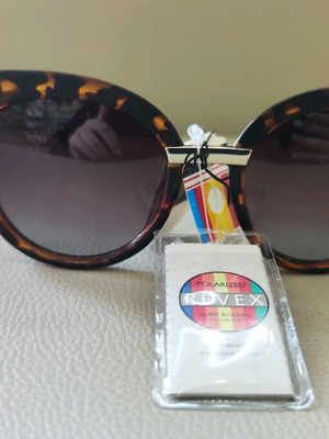 Polirized Revex women's sunglasses new, leopard design, brown lenses