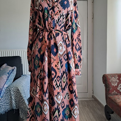 Pom dress used with geometric pattern in pink, blue and green