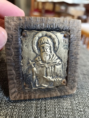 Saint Anthony brass icon on wood