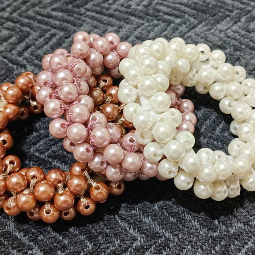 Hair ties new with beads in three colors