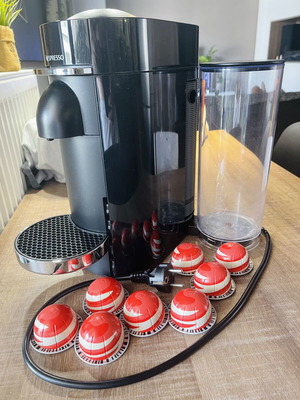 Nespresso Vertuo Plus Deluxe Black coffee machine with 8 capsules