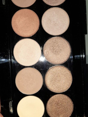 W7 eyeshadow palette with 10 earthy shades and 5 medium makeup brushes, like new