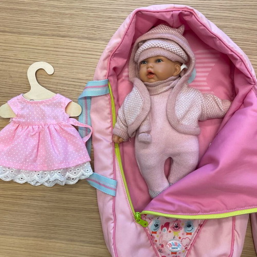 Baby doll like new vinyl with sleeping bag and knitted clothes