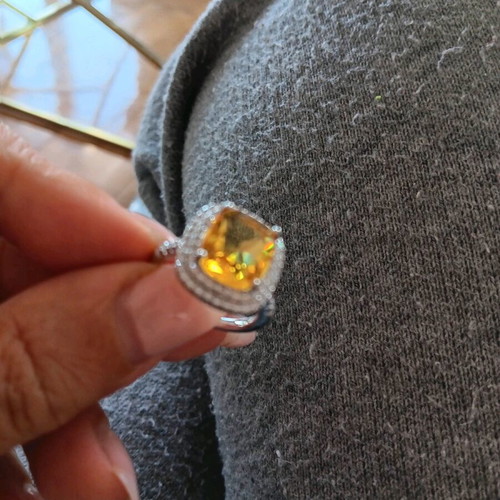 Ring new with large central yellow zircon and white zircons